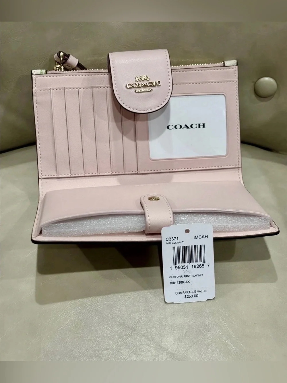 Coach white Leather Multi Color Flower Print phone Wristlet Wallet.
